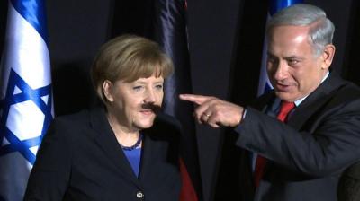 نتنياهو يرسم شارب هتلر على وجه ميركل